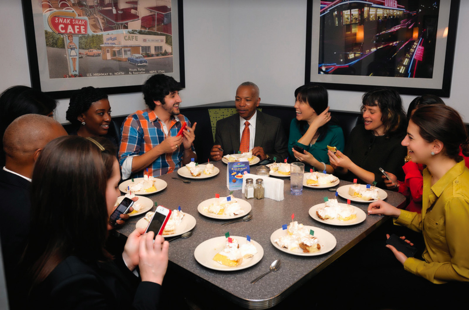Fellows, staff, and clients at pie-tasting contest with Provost of Cambridge College, Dr. Elwood Robinson